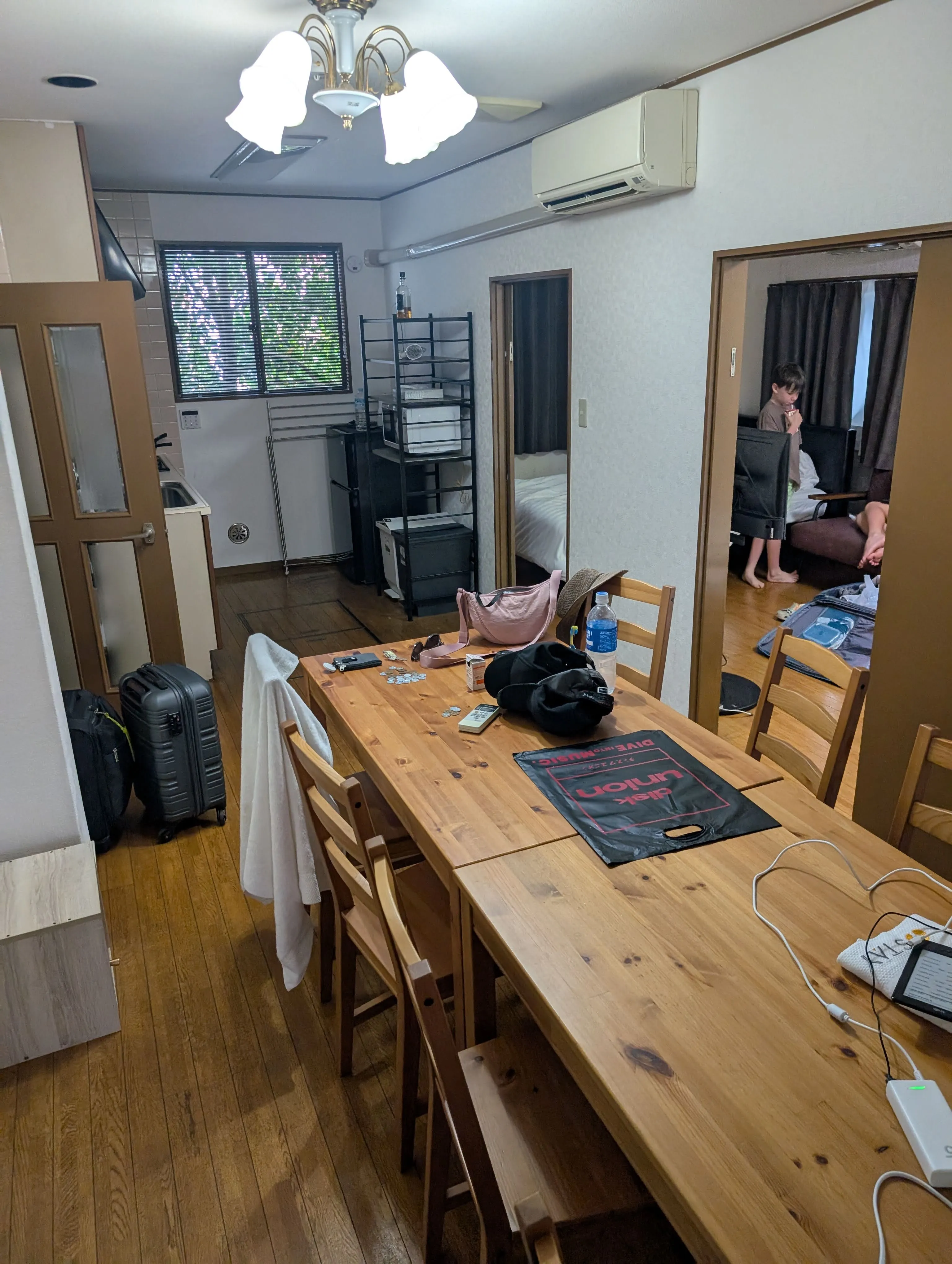 Our Tokyo apartment with a dining table and a separate tatami bedroom through the doorway