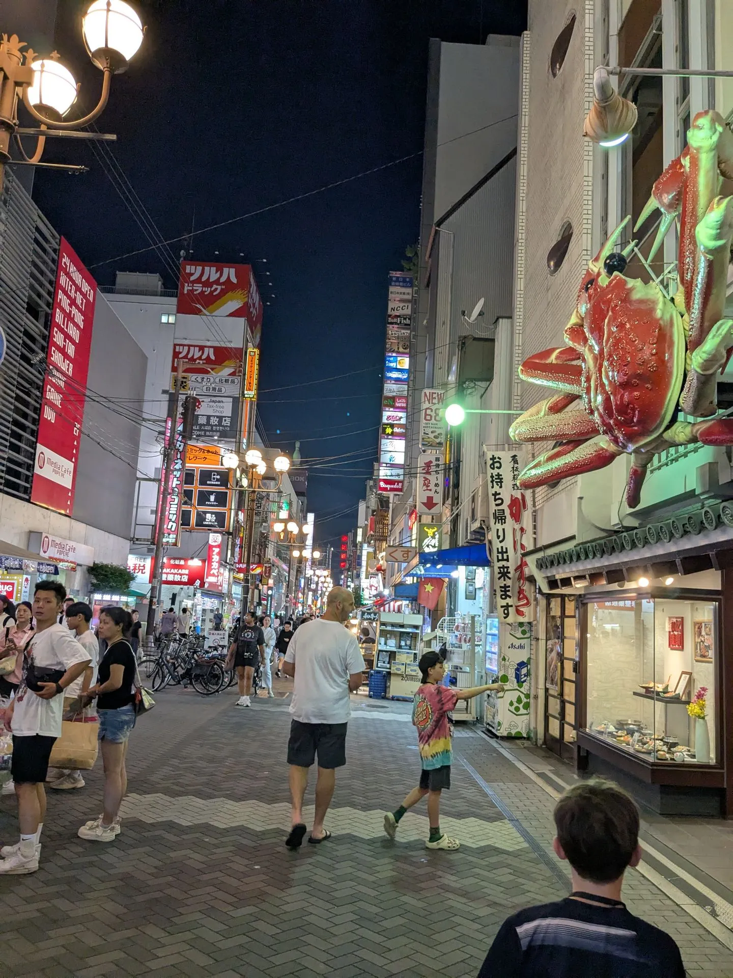 The Dotonbori crab sign lit up at night in Osaka