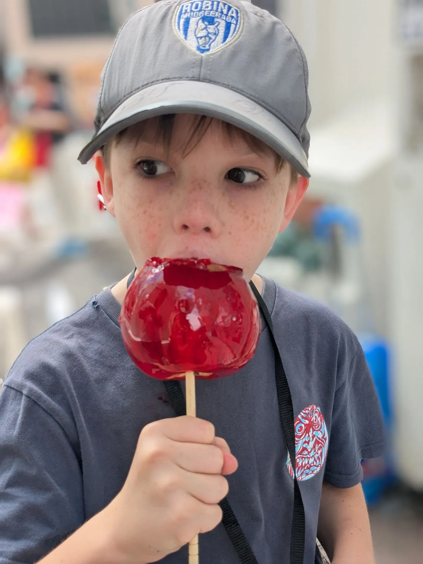 A child holding a candy apple on Takeshita Street, Harajuku, Tokyo
