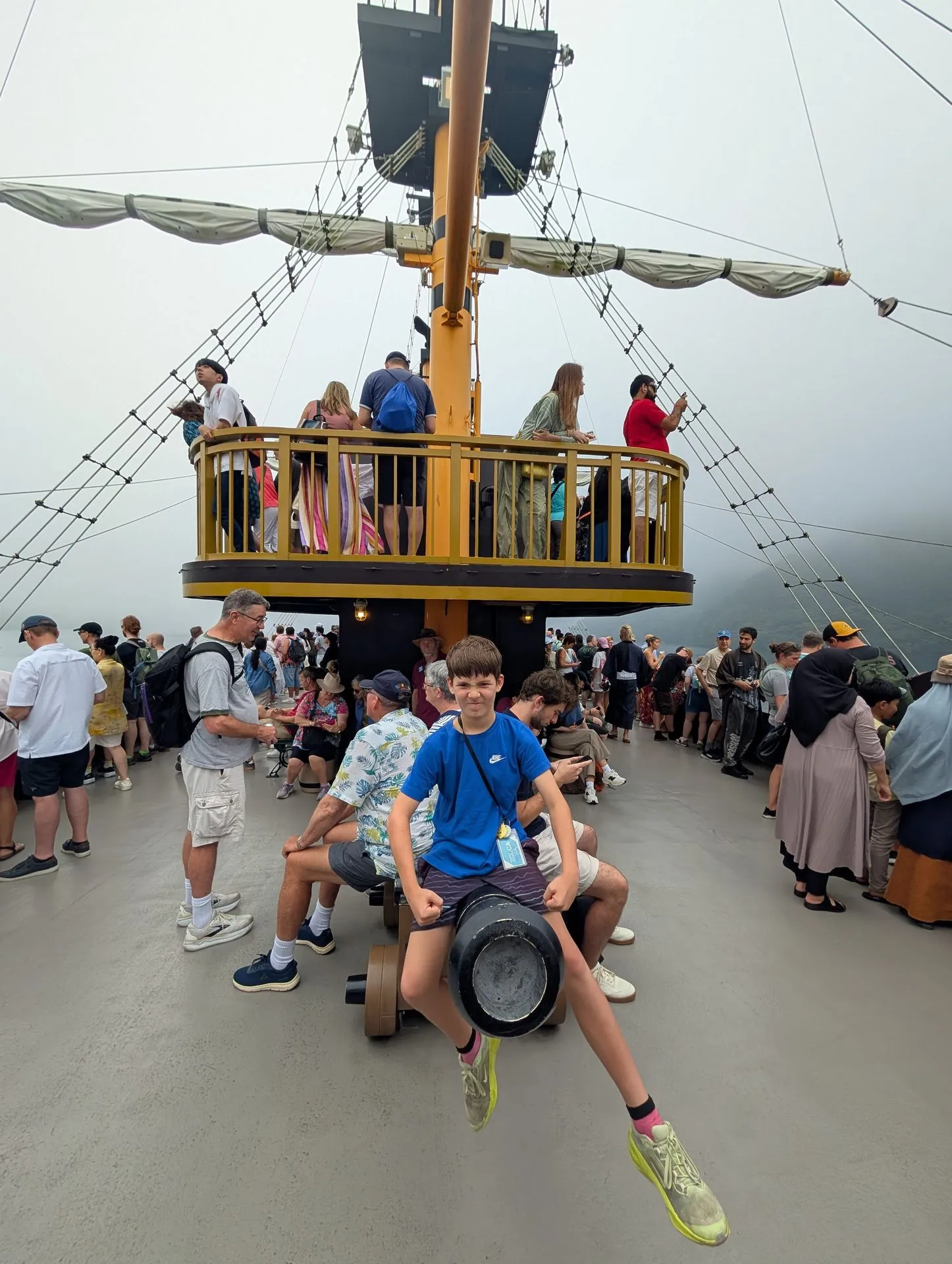 Child at a cannon on the deck of the Lake Ashi pirate ship