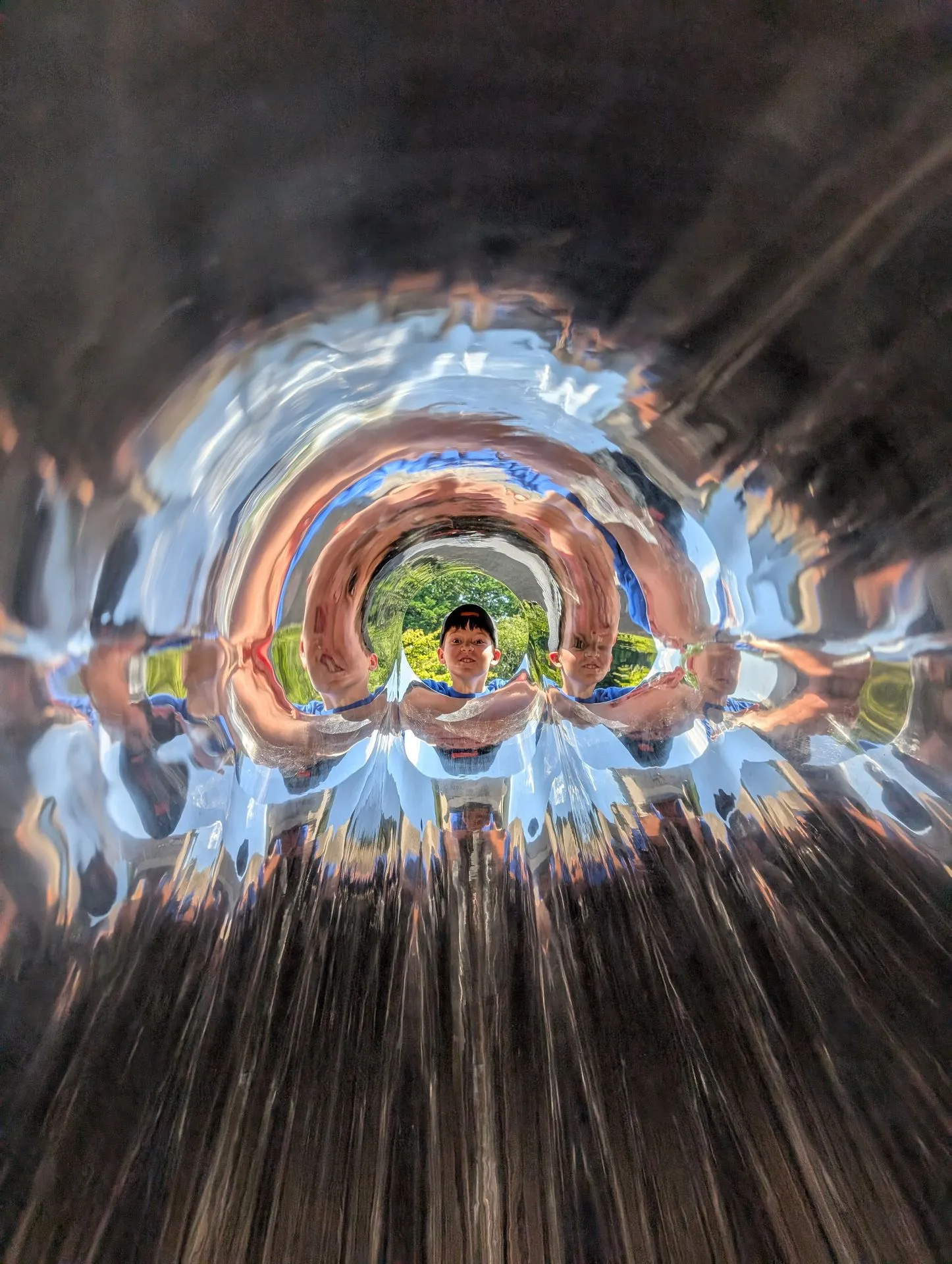 The mirror tunnel sculpture at Hakone Open Air Museum with infinite reflections