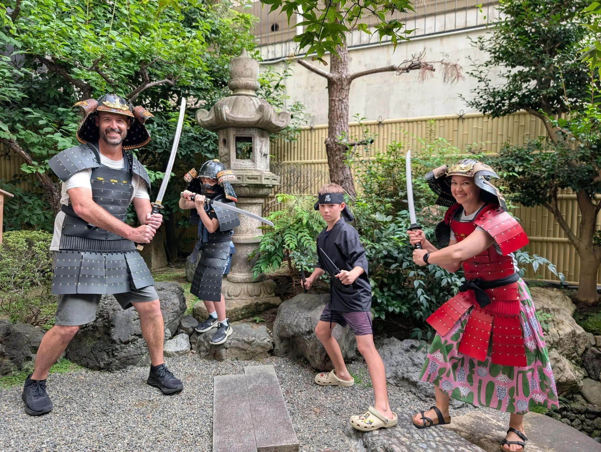 Our family dressed up in samurai armour at the Kyoto Samurai and Ninja Museum garden