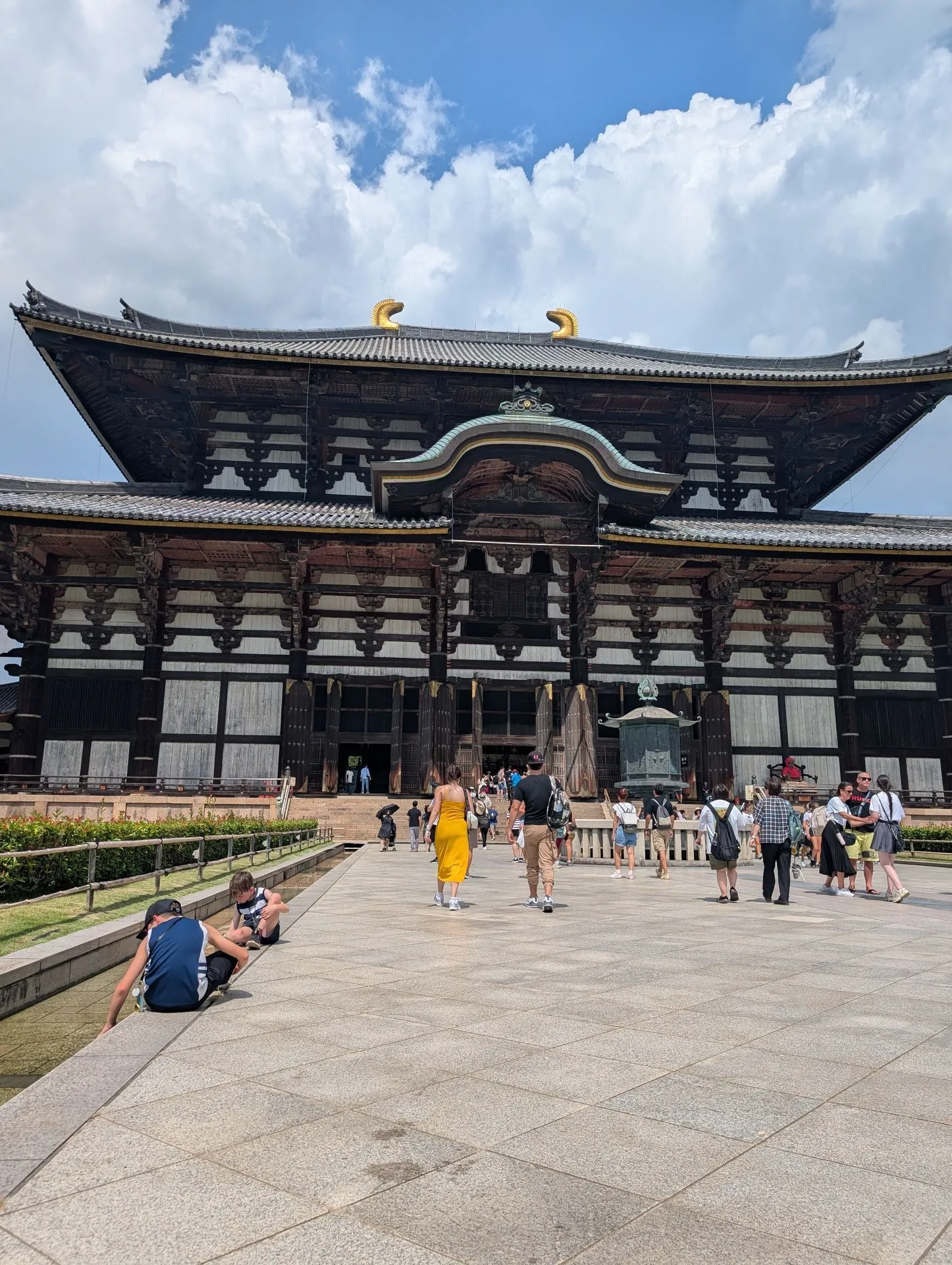 The Todai-ji Daibutsuden temple hall in Nara with deer in the foreground