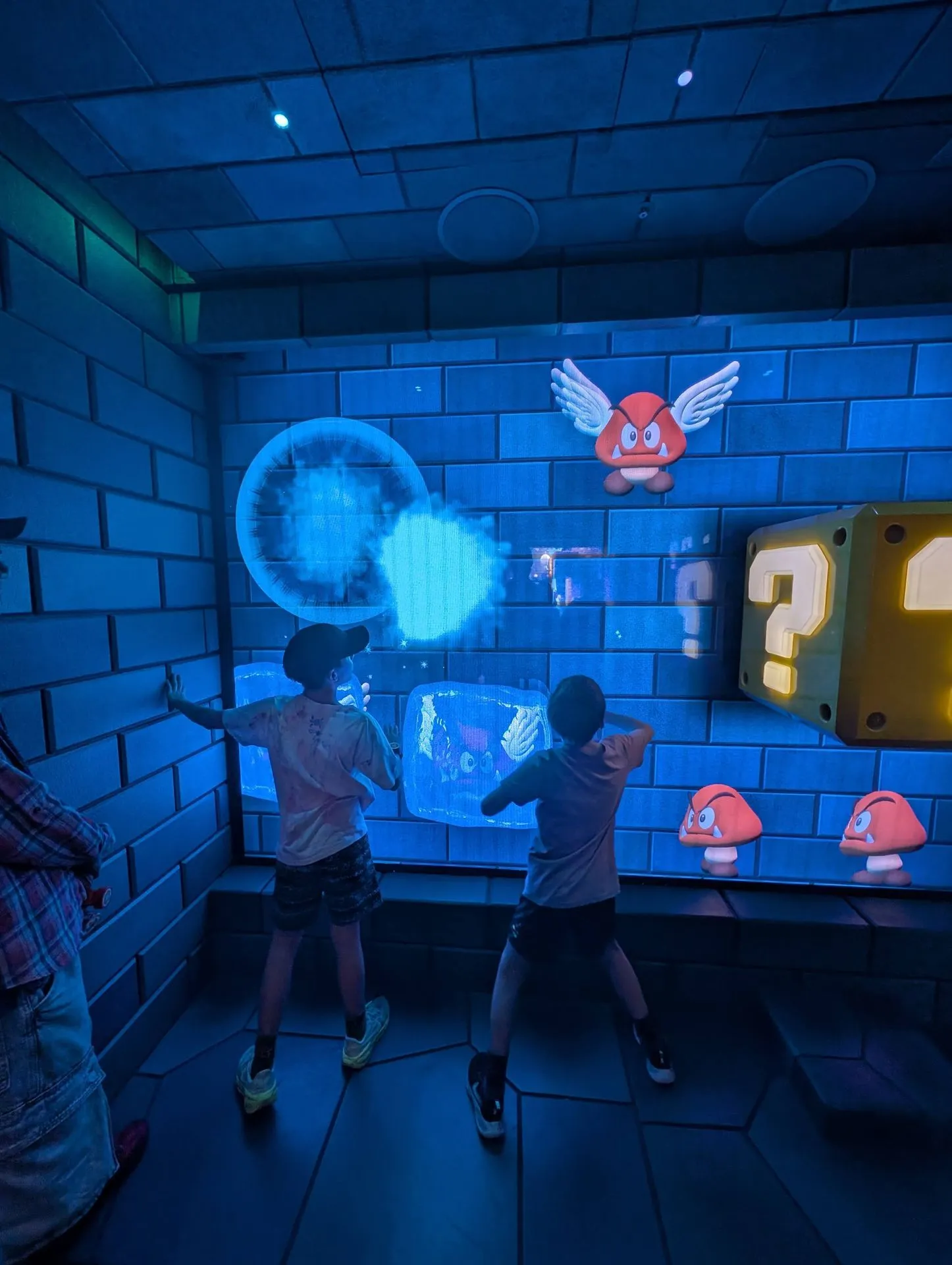 Child playing an interactive game in Super Nintendo World at Universal Studios Japan