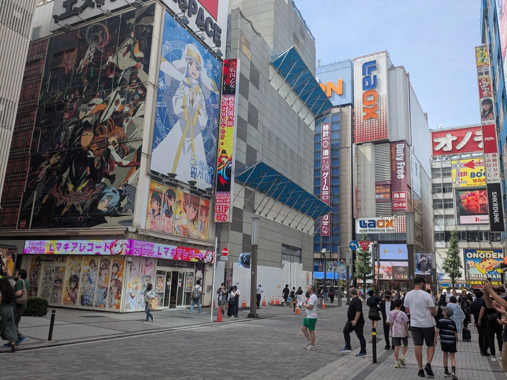 Akihabara Electric Town street with anime and gaming signs covering the buildings