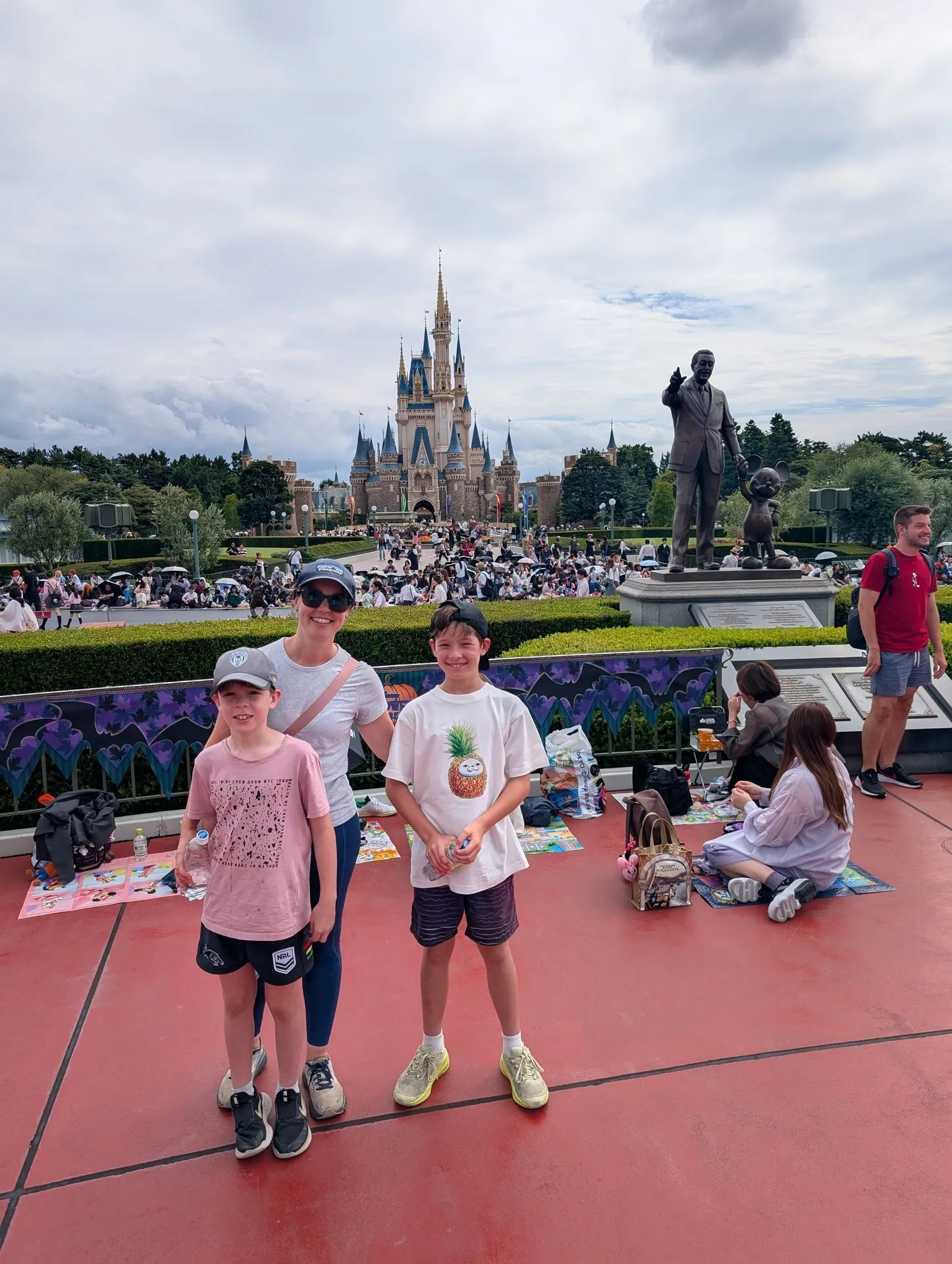 Family in front of Cinderella Castle at Tokyo Disneyland
