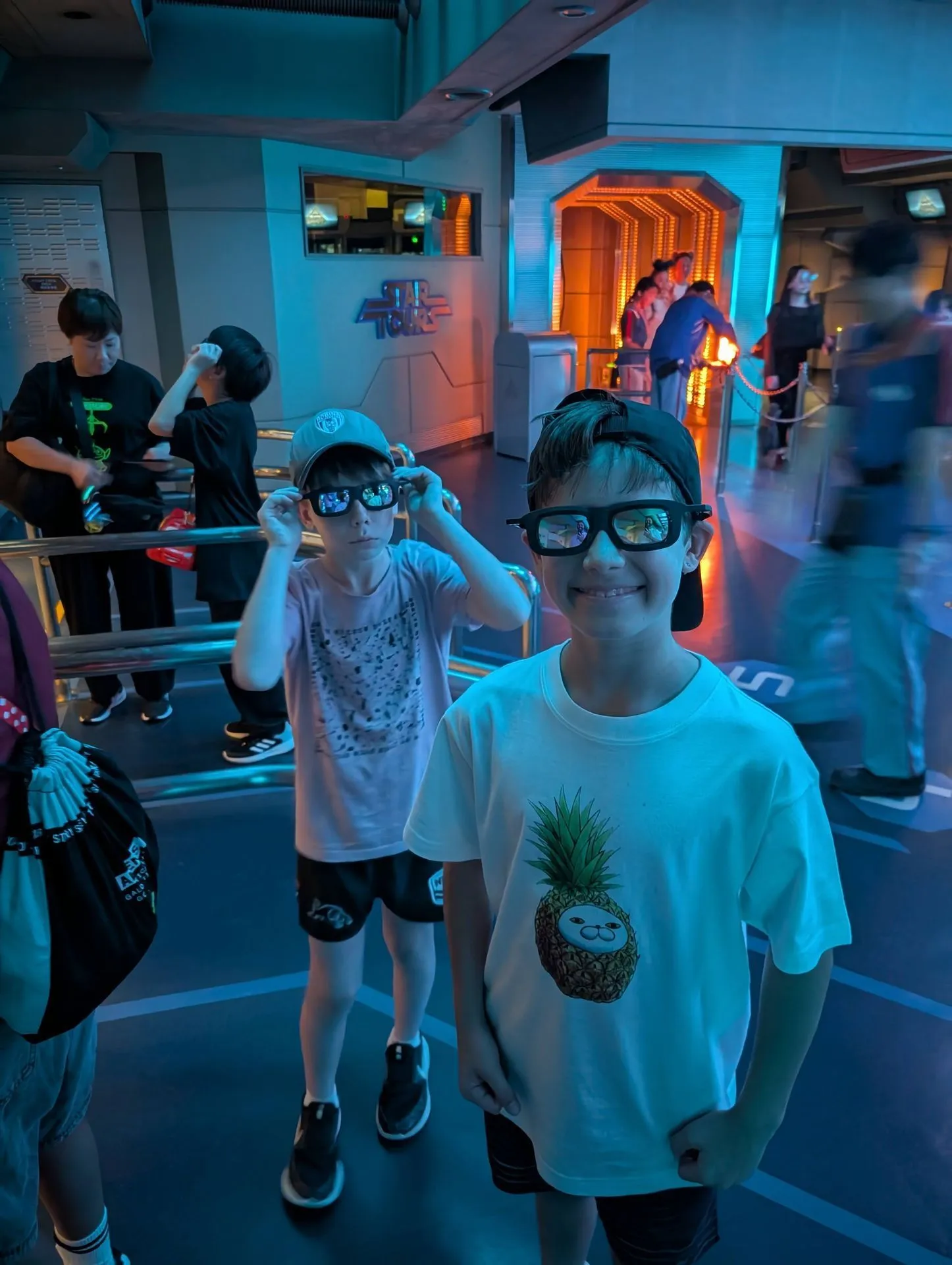 Kids wearing 3D glasses on the Star Tours ride at Tokyo Disneyland