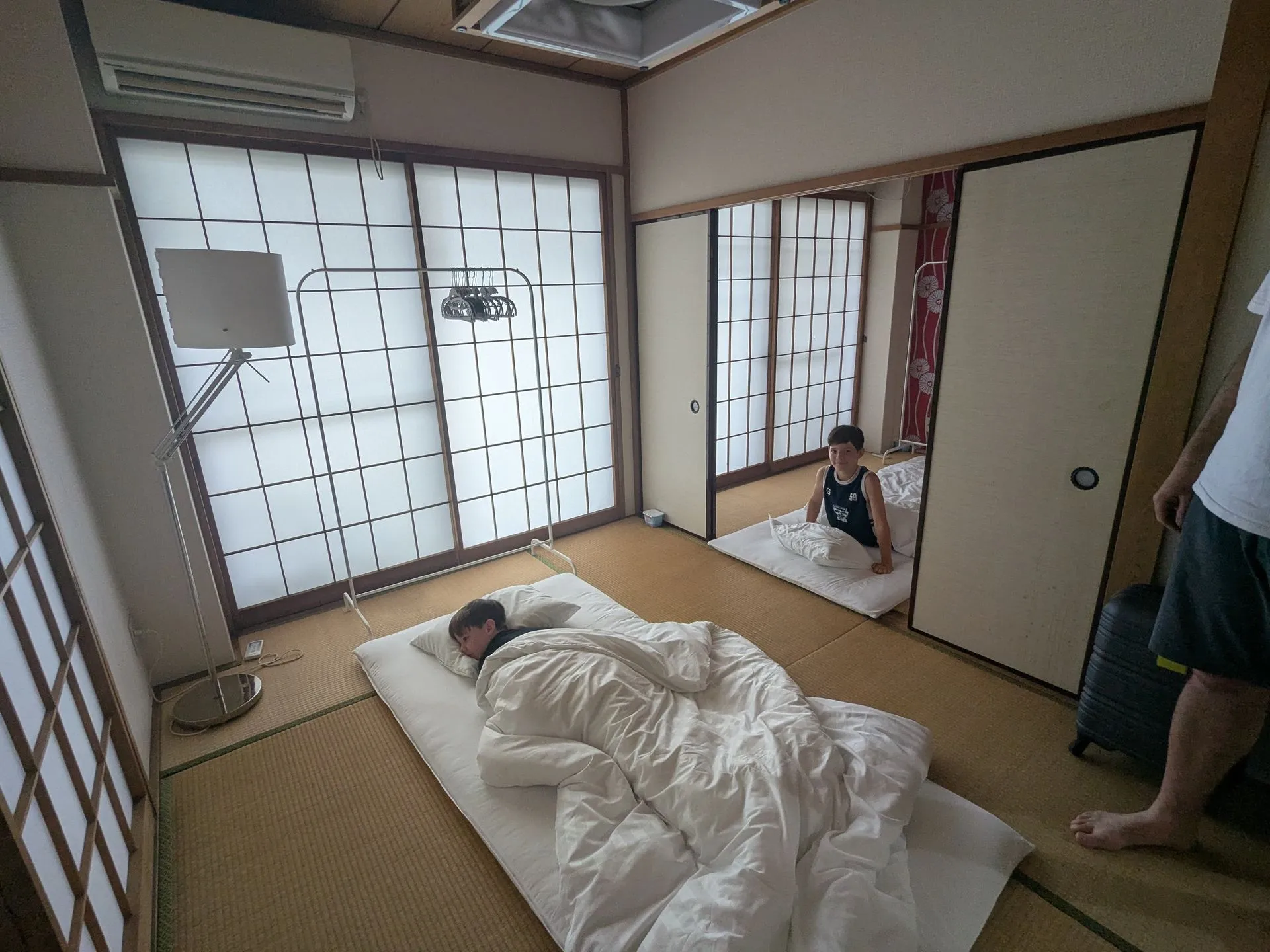 A traditional tatami room set up with futons for sleeping in our accommodation