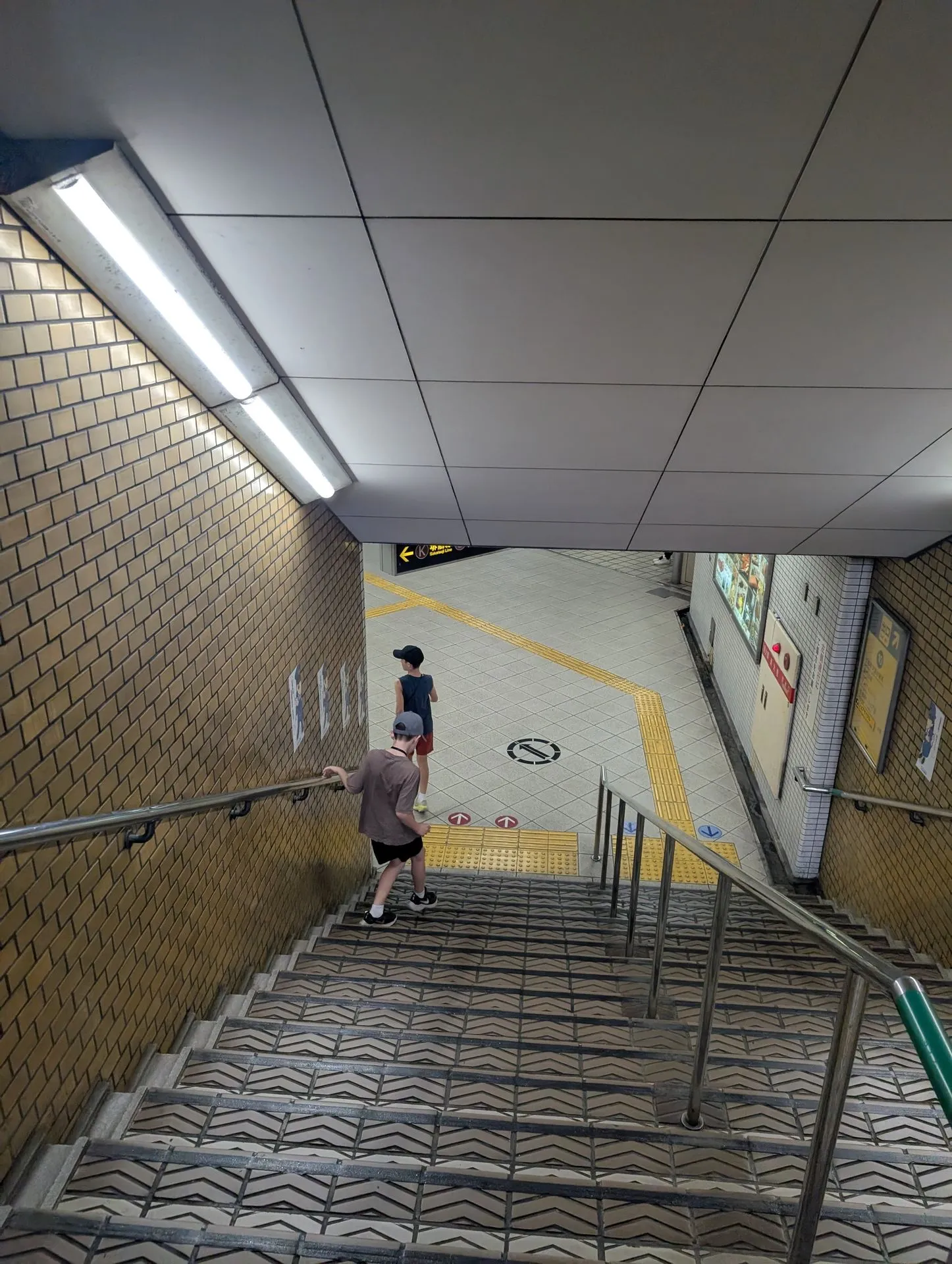 Our family heading down the stairs into Namba subway station, Osaka