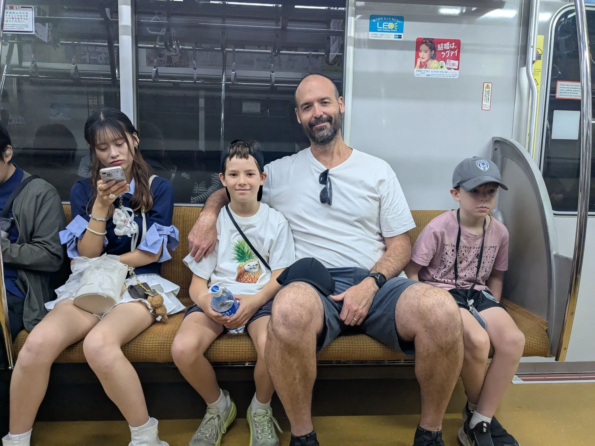 Tired kids in their seats on the Tokyo Metro